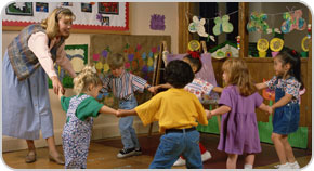 Children and a teacher at a child care center.