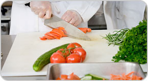 A cook preparing a meal.