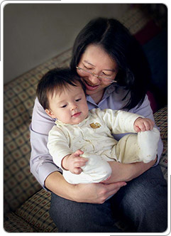 Photo of Joan and her adopted son from Cambodia.